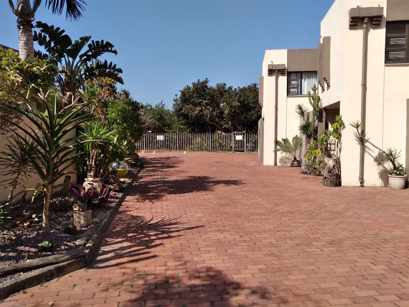 A Cabana Mio garden duplex with its patio and lawn