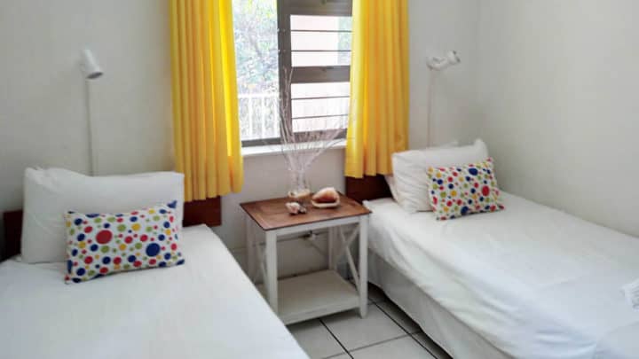 cabana mia luxury self catering accommodation yellow bedroom view 1200